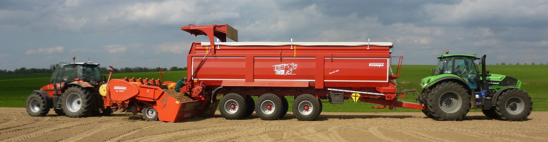 krampe bandit trailer unloading seed potato into planter