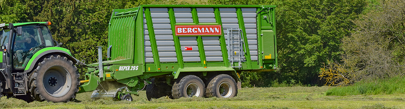 tractor and silage loader grass