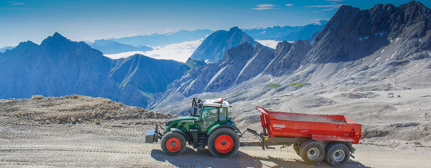 Krampe half pipe hp20 trailer and fendt tractor on mountain
