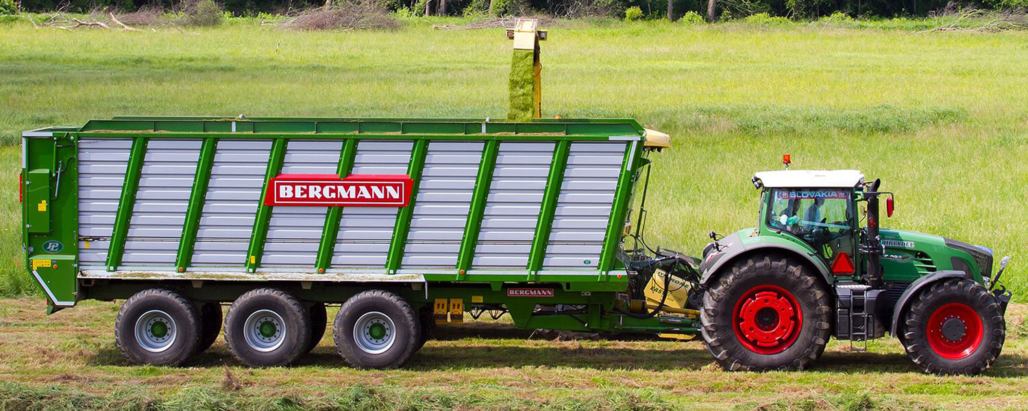 Large silage trailer from Bergmann with fendt 900 series tractor harvesting grass